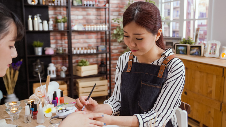 nail technician doing nails 