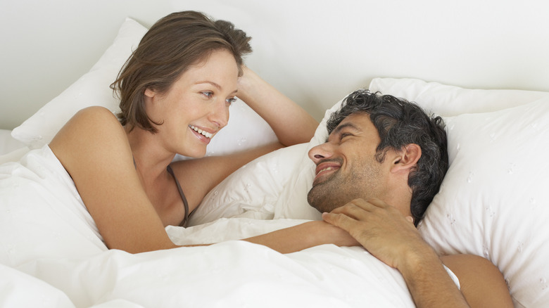 happy couple in bed