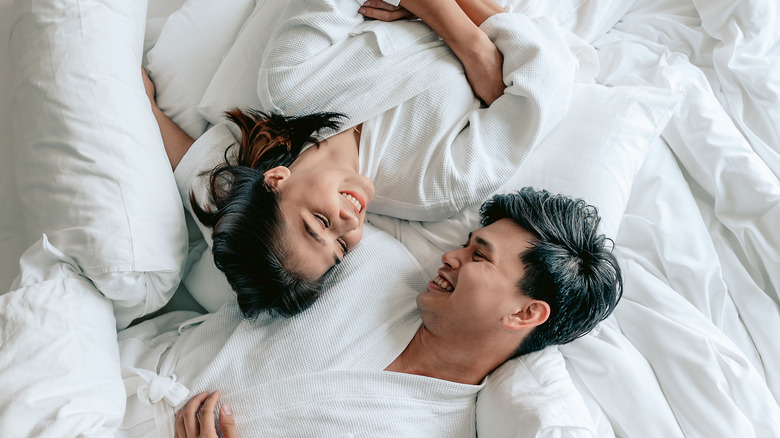 happy couple in bed