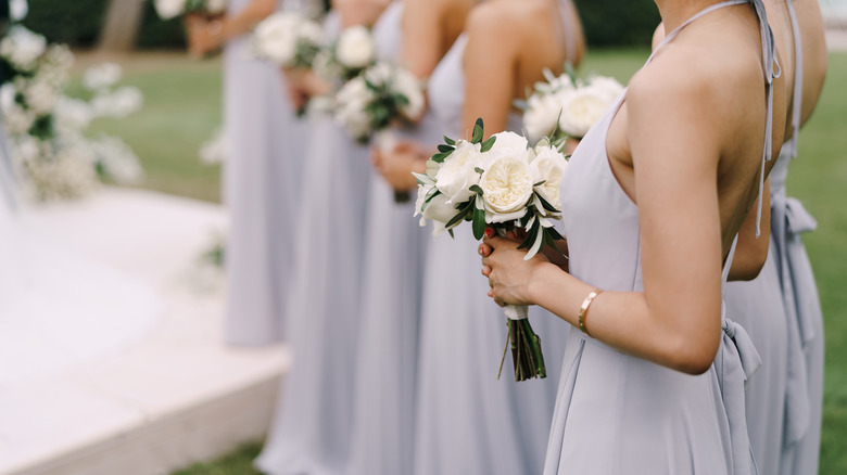 bridesmaids holding flower bouquet