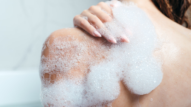 soap lather on woman's shoulder