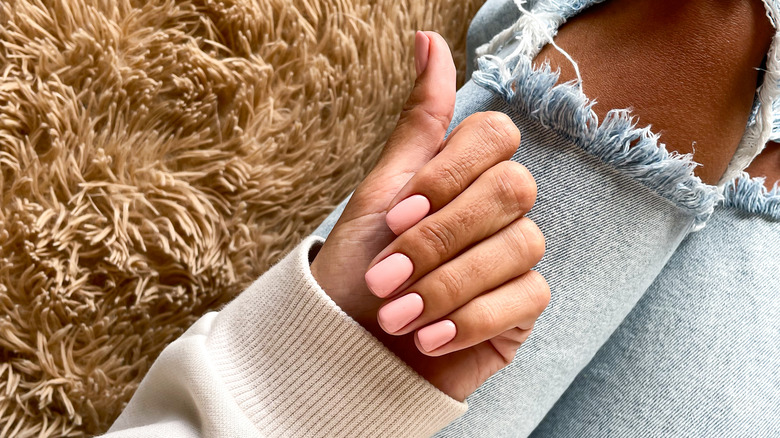 woman with pink nail polish