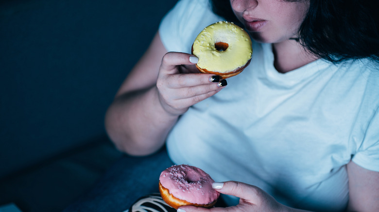 woman eating donut