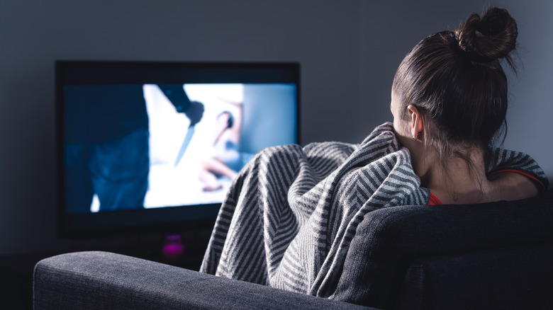 woman watching scary movie