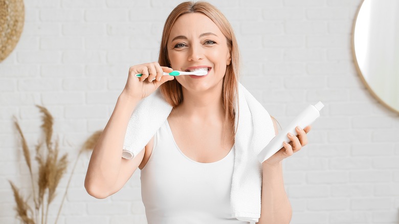 woman brushing teeth