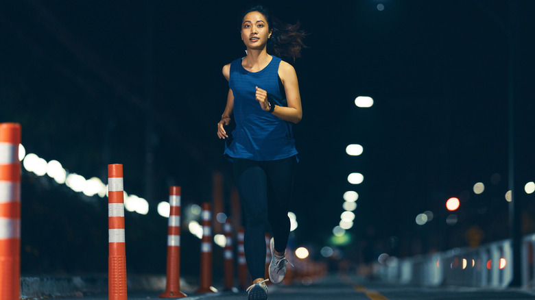 woman jogging at night