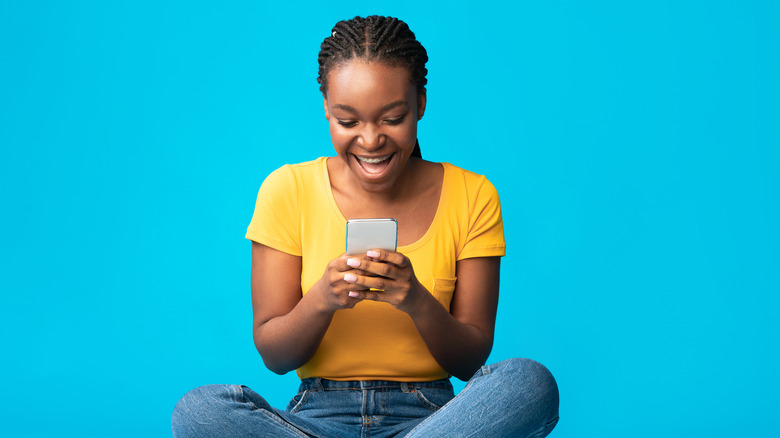 excited woman texting 