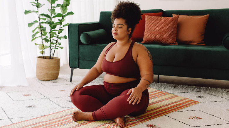 Woman meditating in yoga clothes