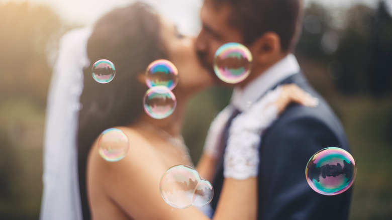 Bride and groom with bubbles
