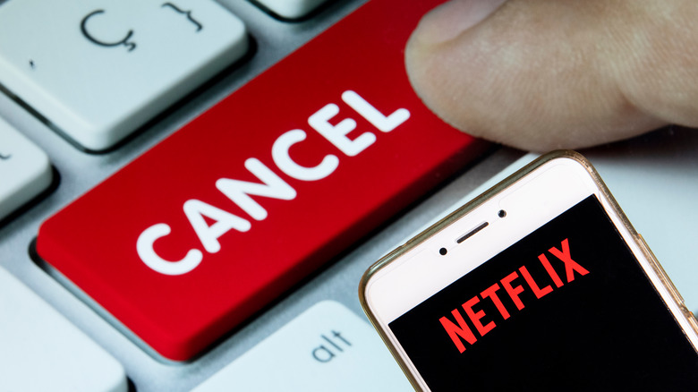 Person canceling Netflix subscription