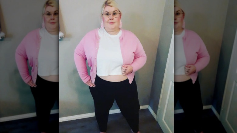 Woman in crop top, cropped cardigan