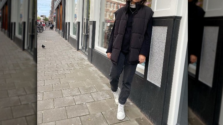 vest and jeans with white boots