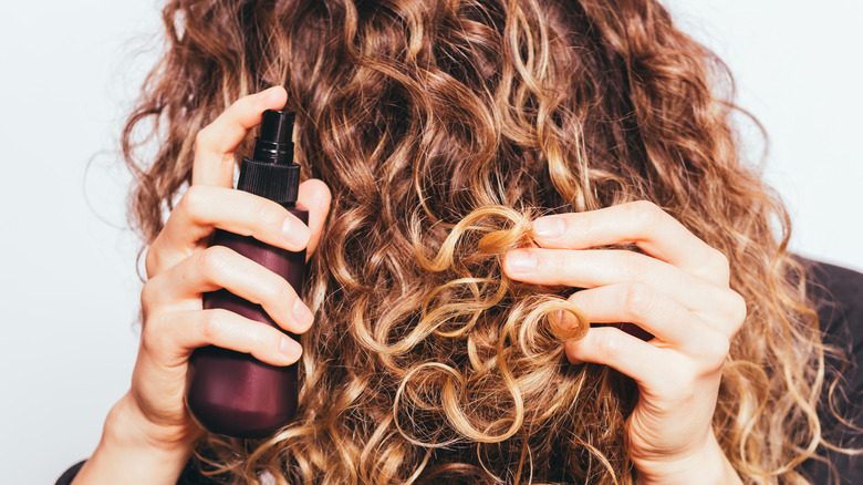 woman using hair products