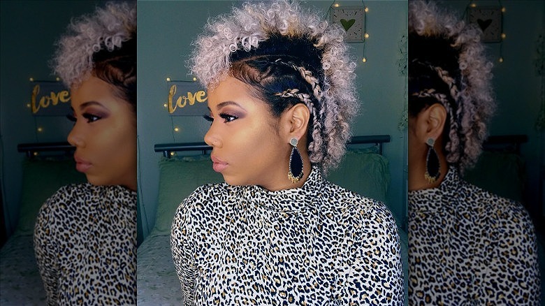 woman with braided mohawk curly hair