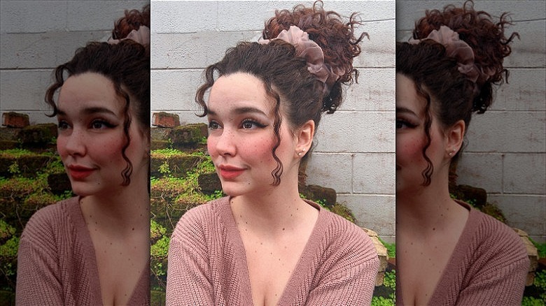 woman with curly top knot