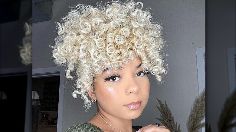 woman with curly hair piled on head