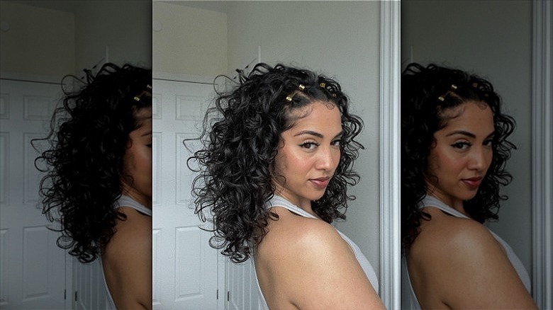 woman with curly pinned back hair