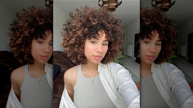 woman with curly afro bangs