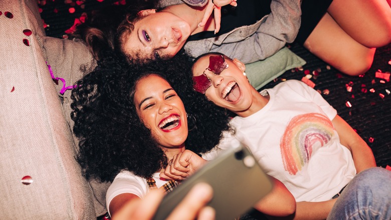 happy friends taking a selfie