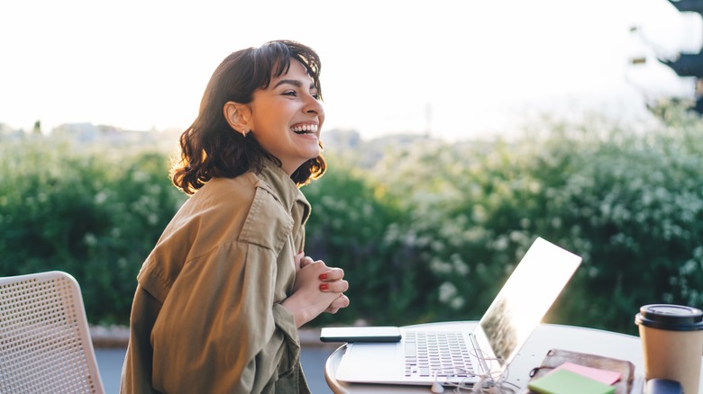 smiling woman with laptop