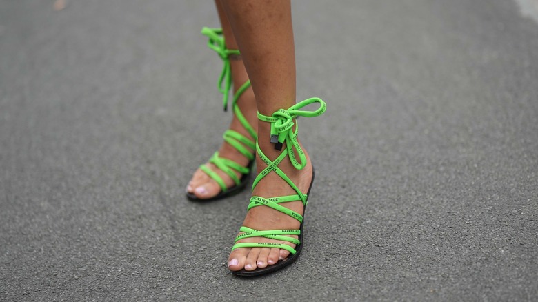 green laced-up sandals