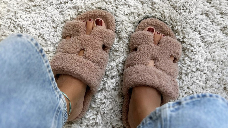 fuzzy sandals on carpet