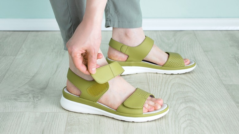 person wearing velcro sandals