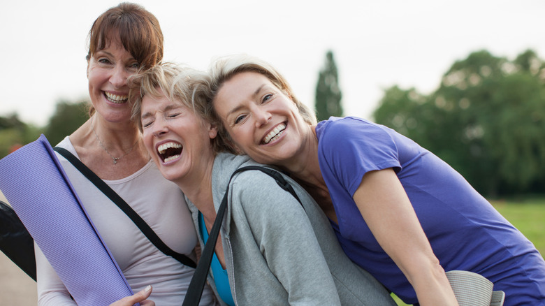 Three women laughing together