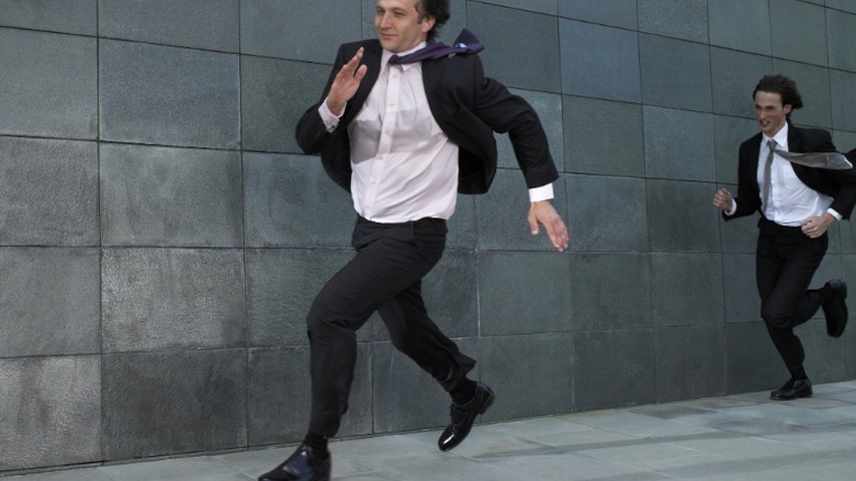 Business man being chased