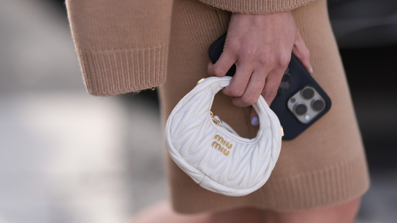 Woman carrying a mini bag