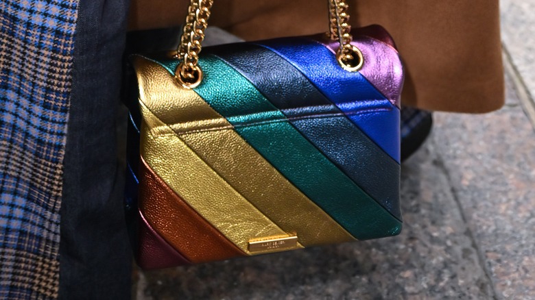 Woman carrying a shimmery bag 