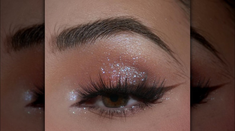 Brown winged eyeliner and glitter eyeshadow