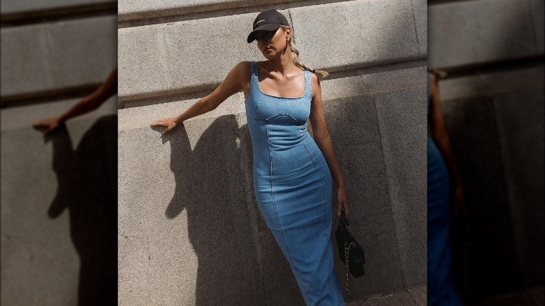 Woman in denim dress, cap