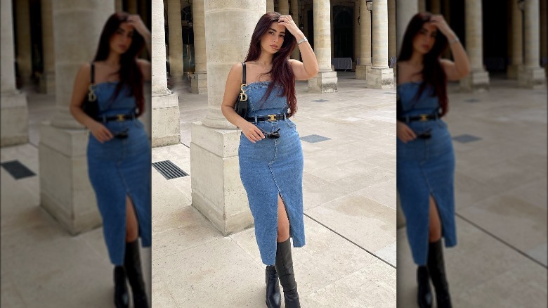 Woman wearing denim dress, belt