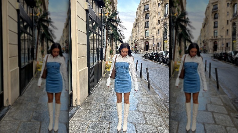 Woman in white shirt, denim dress