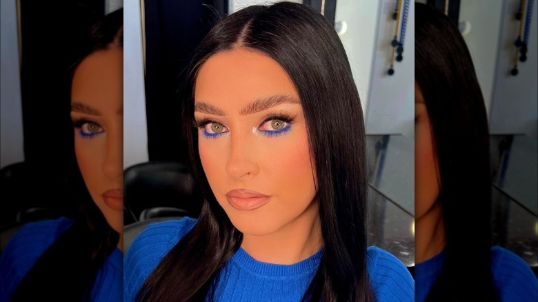 A woman with blue underliner