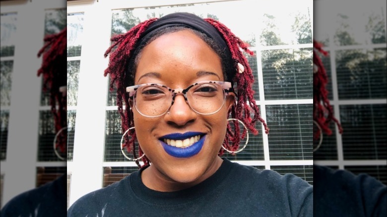 A woman with blue lipstick