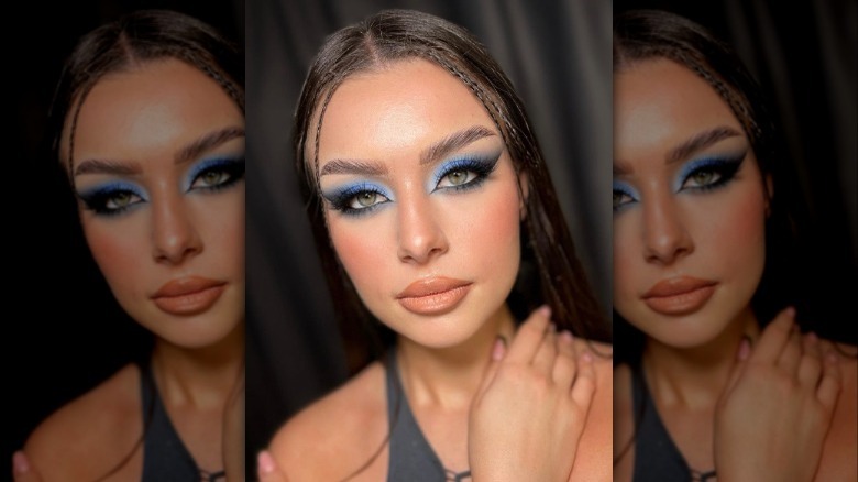 A woman with blue smokey eye