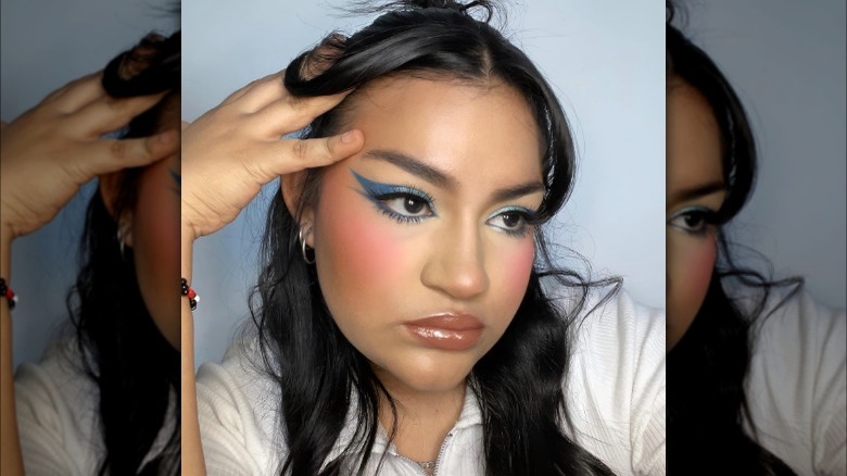 A woman with blue eyeshadow