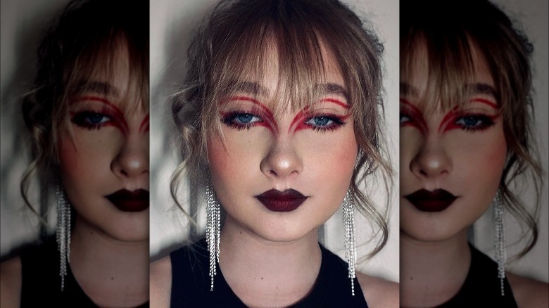 Woman with double red eyeliner