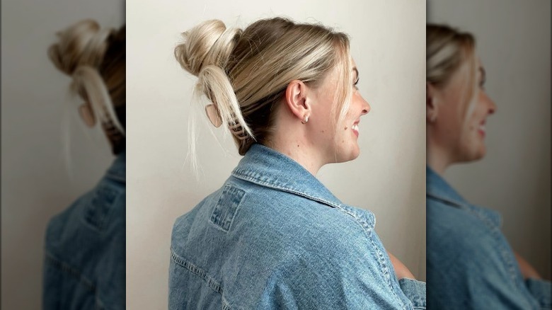 Blonde woman with clipped bun