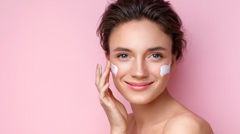 woman using face cream