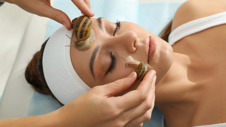 woman getting snail treatment