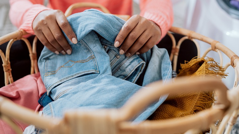 Woman holding a full laundry basket