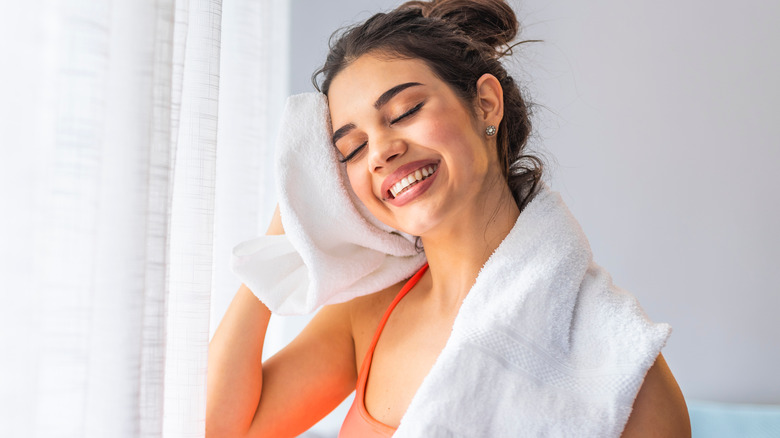 Fitness woman using a towel