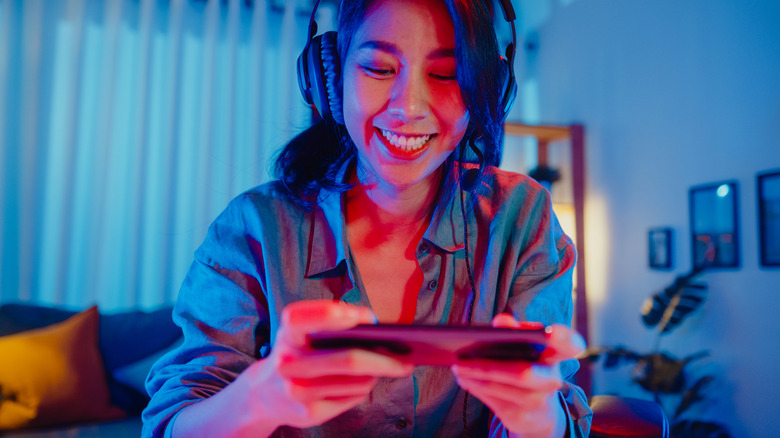 woman using video game headset