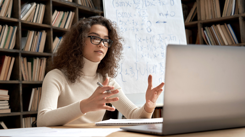 online tutor in front of laptop