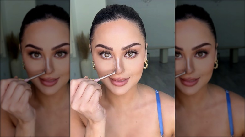 Christen Dominique applying nose contour