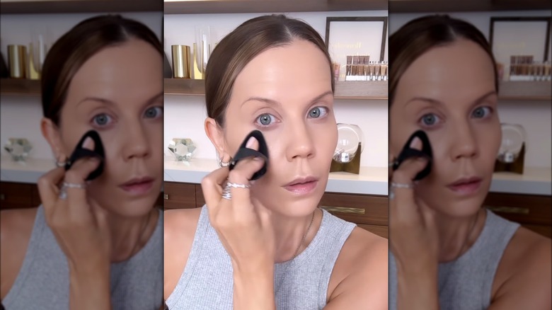 Tati Westbrook applying foundation