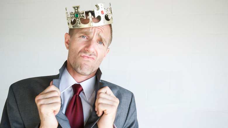 entitled man wearing crown